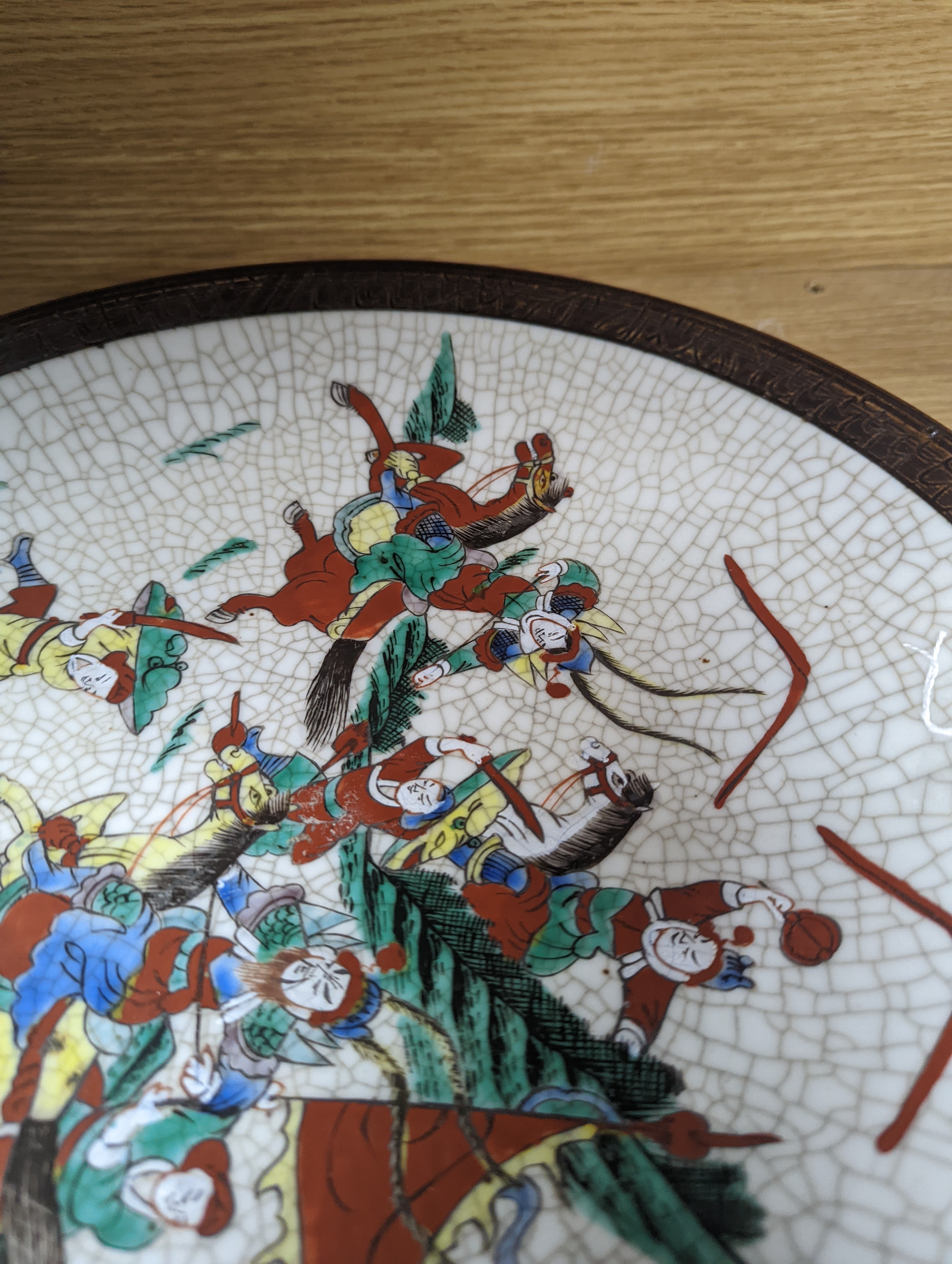 A Chinese famille verte 'warriors' crackle glaze dish 33cm